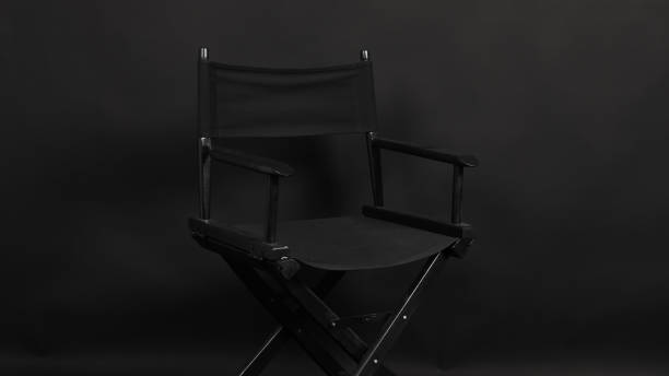 istock BLACK director chair isolated on black background. 1328666296