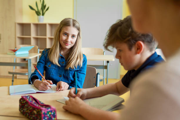 istock Cute schoolgirl smile at the class 1328668262