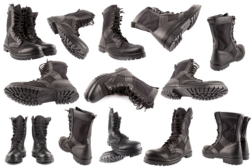 set of new black lightweight military boots isolated on white background, in different views and foreshortenings