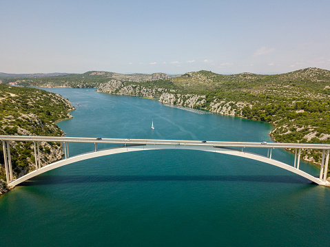 Aerial view of Sibenski Most, croatian bridge. Road and cars. 07-02-2018. Sibenski, Croatia. Central Dalmatia, where the river Krka flows into the Adriatic Sea