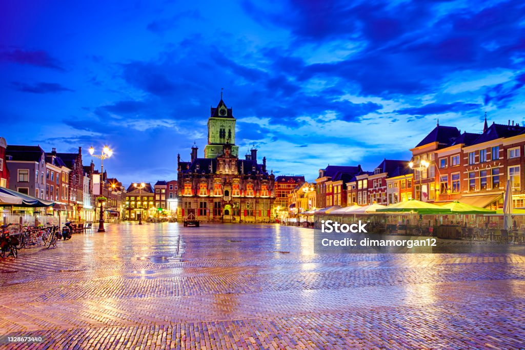 Stadhuis (Known as City Hall) at Local Markt Square (Market Place)  in Dutch Old City Delft during Blue Hour, in Holland, the Netherlands. Horizontal Composition Delft Stock Photo