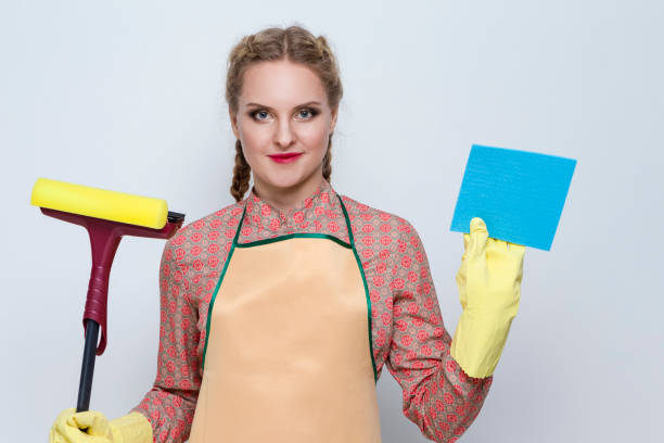 istock Positive Caucasian Female Holding Rubber Scraper Swab While Working With Rubber Gloves and  Smiling Against White. Horizontal Image 1328673718