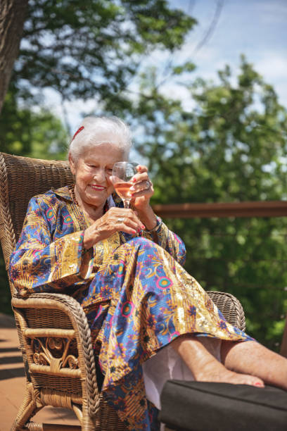 istock Senior woman relaxing on patio 1328674859