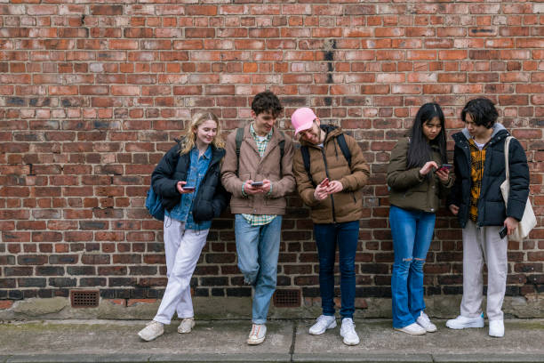 istock Friends Checking Social Media Content 1328677487