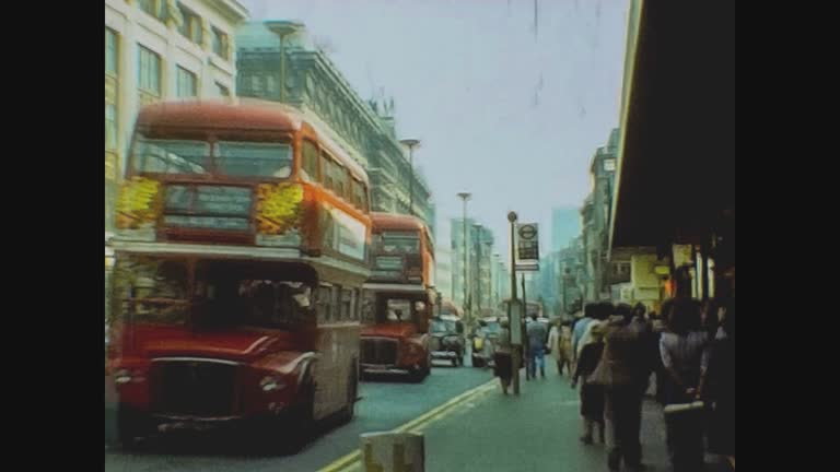 London 1977, London street view with people and traffic in 70's 14