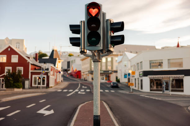 Iceland Akureyri Love Traffic Light Heart Shaped Red Light Iceland Akureyri City Love Traffic Light at Downtown City Road Intersection with a Heart Shaped Red Light. Heart Shaped Love Symbol in Red Stop Light inside a typical City Traffic Light in the City of Akureyri, Northern Iceland. Akureyri, Iceland, Northern Europe. akureyri stock pictures, royalty-free photos & images
