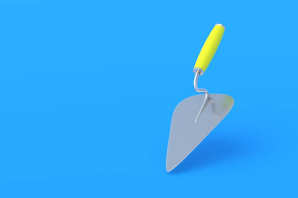 One metal trowel with yellow handle on blue background. Spatula for cement, plaster. Construction of buildings, houses. Professional work tool. Copy space. 3d render