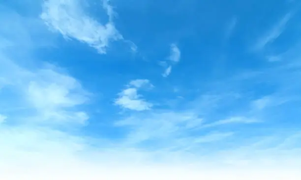 Photo of Summer Blue Sky and white cloud white background. Beautiful clear cloudy in sunlight calm season. Panoramic vivid cyan cloudscape in nature environment. Outdoor horizon skyline with spring sunshine.