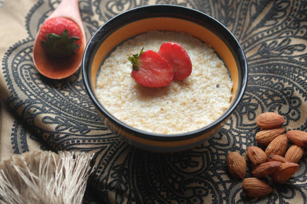istock oats flakes and strawberry on wooden table 1328689409