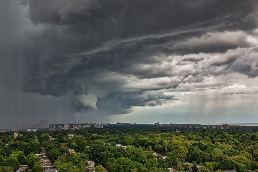 Amazing wall clouds with Funnel cloud formation and downpour over east Toronto in summer sky