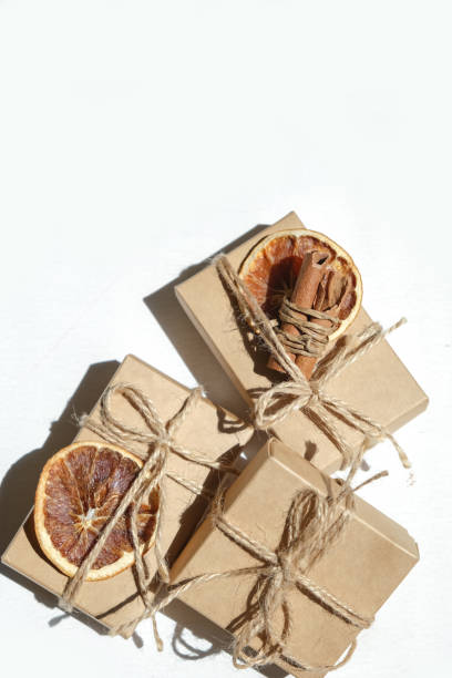 istock Gift box.Christmas zero waste box eco friendly packaging.Flat lay packs gifts kraft paper green ribbon white background,ecological Christmas holiday concept,eco decor,gift background,holiday 1328691630