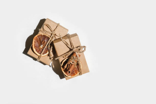 istock Gift box.Christmas zero waste box eco friendly packaging.Flat lay packs gifts kraft paper green ribbon white background,ecological Christmas holiday concept,eco decor,gift background,holiday 1328691706