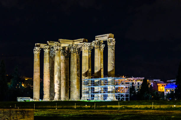 Night scene olympic zeus temple ruin monument located at athens city, greece