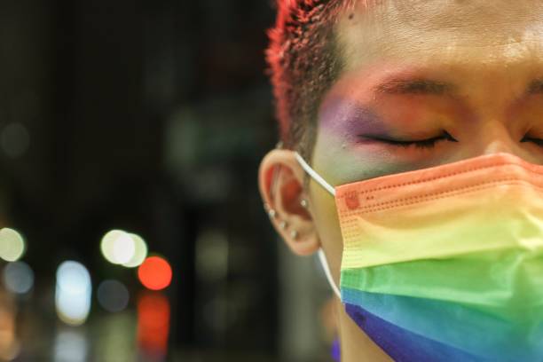 istock Asian man wearing a Rainbow Mask 1328693890