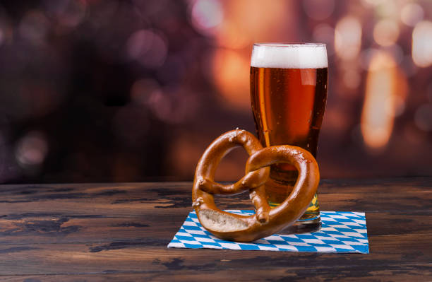 Glass of beer and pretzel stock photo