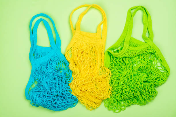 istock Reusable eco bags on green 1328696010