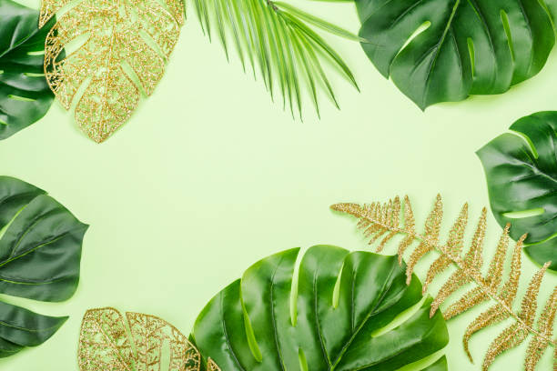istock Golden painted tropical leaves 1328696024
