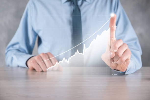 istock Businessman man holding a graph with positive profits growth. plan graph growth and increase of chart positive indicators in his business.more profitable and growing 1328696355