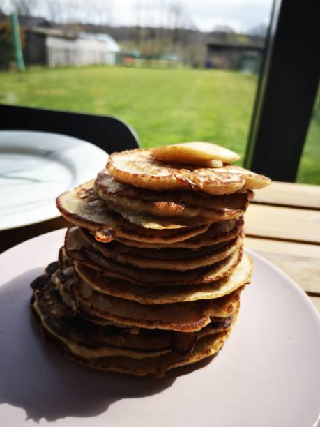 istock Stack of pancakes on a pink plate 1328697369