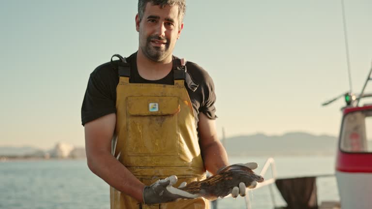 Portrait of Independent Fisherman Showing Fresh Catch