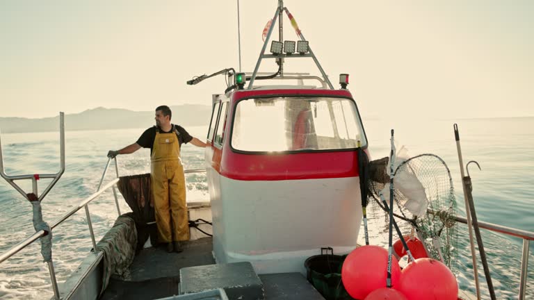 Candid Portrait of Fisherman Motoring in Mediterranean Sea