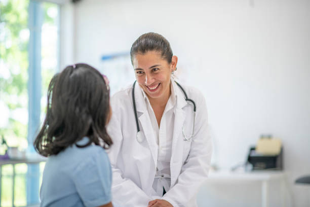 istock Child visits doctor 1328702718