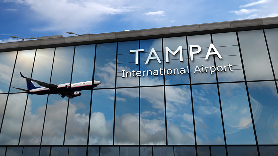 Aircraft landing at Tampa, Florida, USA 3D rendering illustration. Arrival in the city with the glass airport terminal and reflection of jet plane. Travel, business, tourism and transport.