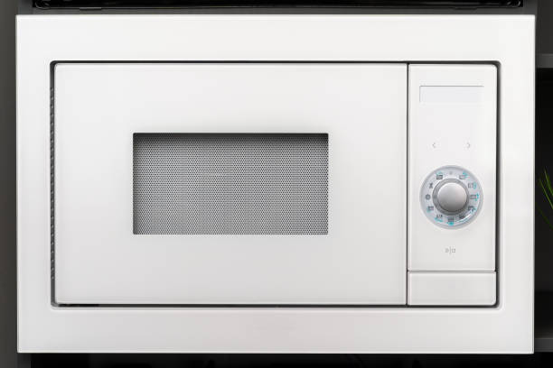 istock New modern microwave oven in a shop, close up 1328708767