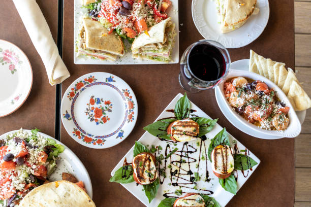 Overhead view of table filled with plates of food in a restaurant Overhead view of table filled with plates of food in a restaurant in Chandler, AZ, United States chandler arizona stock pictures, royalty-free photos & images