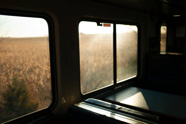 istock Late afternoon light entering passenger train car 1328711710