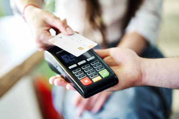 istock Customer paying cashless with credit card in a bar 1328713986