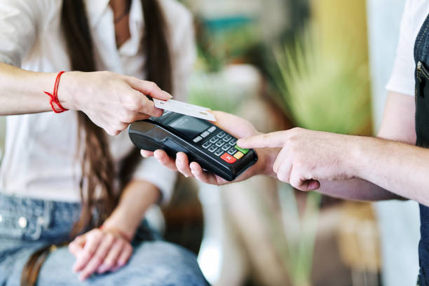 istock Customer paying cashless with credit card in a bar 1328713990
