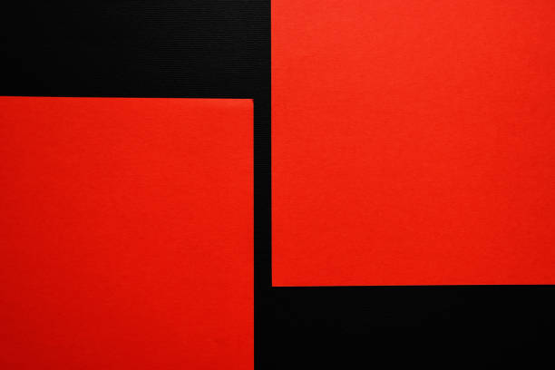 istock Sheets of red paper on black background 1328714227