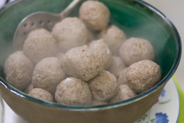 A bowl of Matzah balls, or matzo balls, Ashkenazi Jewish soup dumplings, traditionally eaten in the Jewish holiday of  Passover stock photo