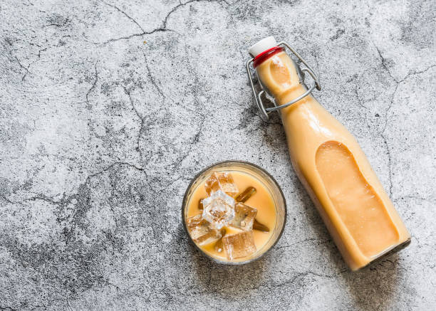 Cold masala iced tea on a gray background, top view.Refreshing invigorating drink in the Indian style Cold masala iced tea on a gray background, top view.Refreshing invigorating drink in the Indian style ayurveda cardamom star anise spice stock pictures, royalty-free photos & images