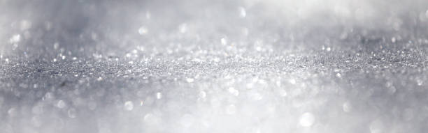 istock Snow close-up, winter background with copy space, glittering snowflakes with bokeh. 1328718608