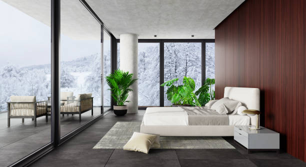 istock Luxury Hotel Modern interior bedroom with large windows. Winter scene mountain forest.. 1328718756
