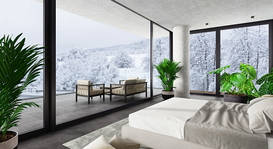 Modern luxury hotel interior bedroom with large windows and big terrace with outdoor furniture.
Winter scene mountain forest. 3d rendering.