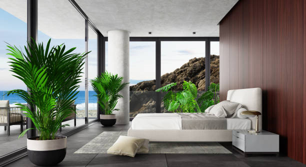 istock Luxury Hotel Modern interior bedroom with large windows. Spring scene ocean side with big rock. 1328719010
