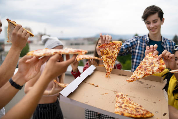 istock Party with pizza on the rooftop 1328721584