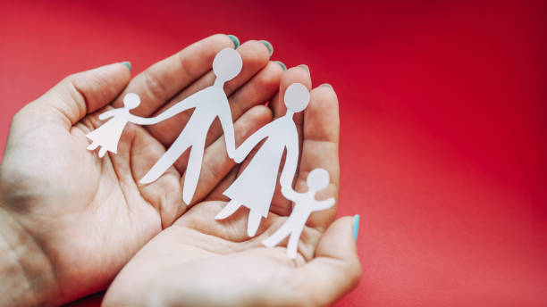 istock The hands are holding white paper family 1328725507