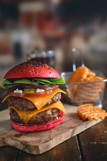 istock Red Bun Double Beef Burger with Tomato, Cheese, Pickles Served with Chip Fries 1328727609