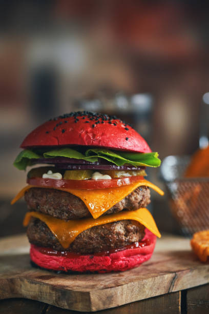 istock Red Bun Double Beef Burger with Tomato, Cheese, Pickles Served with Chip Fries 1328727664