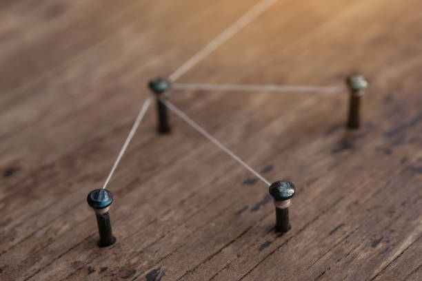 istock Network connected with yarn white on plank wood 1328728192