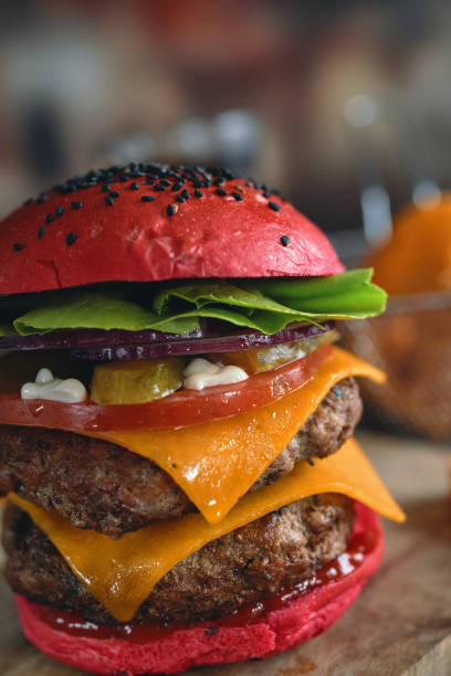 istock Red Bun Double Beef Burger with Tomato, Cheese, Pickles Served with Chip Fries 1328728580