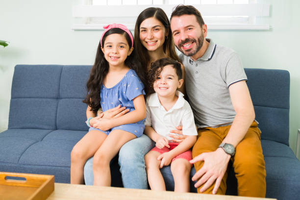 istock Happy parents with her son and daughter 1328730193