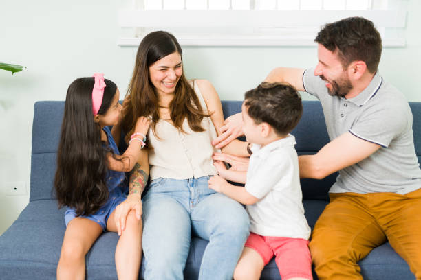 istock Adorable kids playing with her happy parents 1328730263