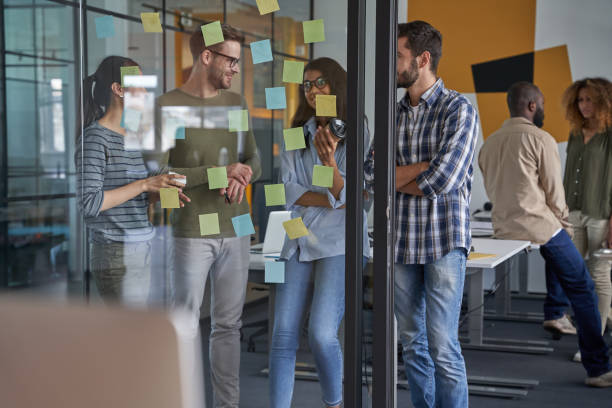 istock Colleagues discussing speaking about conditions of new project 1328733809