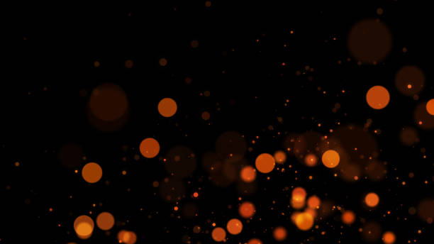 istock Defocused Lights and Particles against Black Background 1328733858