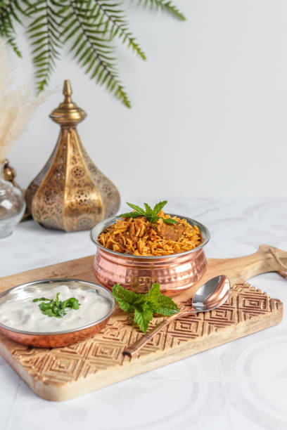 istock Traditional Lamb Biriyani mutton with yogurt dip raita 1328733872